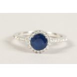 AN 18CT WHITE GOLD, SAPPHIRE AND DIAMOND RING of 1.4cts.