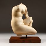 A LOUVRE COPY OF AN ANTIQUITY, kneeling female figure. 12ins high.