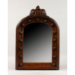 A SMALL GOTHIC REVIVAL OAK HALL MIRROR, with carved decoration. 19.5ins high x 13ins wide.