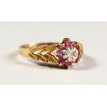 A 9CT GOLD, DIAMOND AND RUBY SET RING.