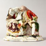 AN 18TH CENTURY STYLE CONTINENTAL PORCELAIN GROUP OF LOVERS ON A RUSTIC BENCH. 8ins high.