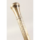 AN ENGRAVED SILVER WALKING STICK HANDLE. 11ins long.