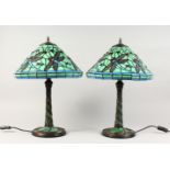 A PAIR OF TIFFANY STYLE GREEN GLASS DRAGONFLY TABLE LAMPS. 22ins high.