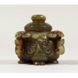 A SMALL CHINESE JADE LIDDED POT, with four rams masks.