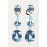 A PAIR OF SILVER AND BLUE TOPAZ DROP EARRINGS.