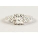 AN 18CT WHITE GOLD ART DECO STYLE DIAMOND CLUSTER RING of over 1ct.
