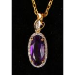 AN 18CT YELLOW GOLD SUBSTANTIAL AMETHYST AND DIAMOND PENDANT NECKLACE.