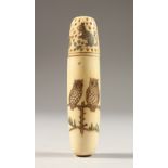 AN ETCHED BONE THIMBLE CASE, engraved with owls. 5.25ins long.