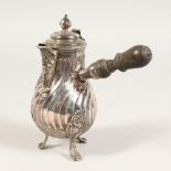 A FRENCH SILVER WRYTHEN FLUTED PEAR SHAPED CHOCOLATE POT, with turned wooden handle.