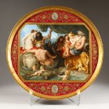 A LARGE 19TH CENTURY VIENNA PORCELAIN CIRCULAR PLAQUE, painted with "The Four Continents", after