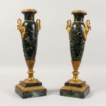 A PAIR OF FRENCH ORMOLU MOUNTED MARBLE URNS, with swan handles, on square bases. 15.5ins high.