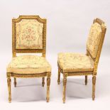 A PAIR OF 19TH CENTURY CARVED AND GILDED SIDE CHAIRS, with floral upholstered overstuffed backs