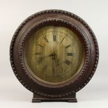 AN UNUSUAL 19TH CENTURY LARGE CIRCULAR WALL/MANTLE CLOCK, the silvered dial engraved with Roman