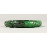 A DARK JADE BANGLE.