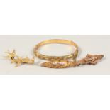 A 9CT GOLD BRACELET and THREE BROOCHES.