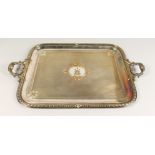 A GOOD LARGE RECTANGULAR TWIN HANDLED TRAY, engraved with a crest. 28.5ins wide.