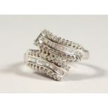 AN 18CT WHITE GOLD DOUBLE ROW DIAMOND SET RING.