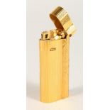 A DUNHILL GILT LIGHTER, No. 070629.