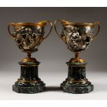 A PAIR OF FRENCH BRONZE, AND SILVERED BRONZE CLASSICAL CUPS, cast with classical figures, on
