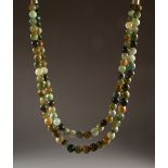 A MULTI-COLOUR JADE NECKLACE, with silver clasp. 17ins long.
