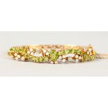 A LOVELY PERIDOT AND OPAL GOLD BRACELET.