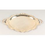 AN ENGRAVED TWIN HANDLED TRAY, with ornate cast border. 25ins wide.
