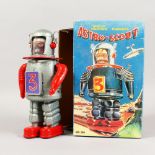 AN ASTRO SCOUT CLOCKWORK ROBOT, boxed. 9ins high.