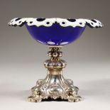 A CONTINENTAL SILVER MOUNTED BOHEMIAN GLASS TAZZA. 7ins diameter.