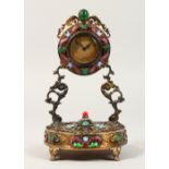 A VERY GOOD RUSSIAN SILVER GILT CLOCK, set with semi-precious stones, with gilded face. 8ins high.