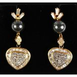 A PAIR OF 18CT YELLOW GOLD SOUTH SEA PEARL AND HEART SHAPED EARRINGS.