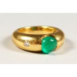 AN 18CT GOLD, CABOCHON EMERALD AND DIAMOND RING.
