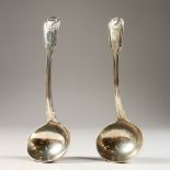 A SAUCE LADLE, with shell decorated bowl and terminal, London 1806, and a similar ladle (2). 7ins