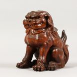 A CERAMIC BRONZED CHINESE DOG. 7ins high.