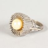 A WHITE GOLD RING set with a pearl.