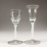 A GEORGIAN WINE GLASS, with inverted bell bowl and opaque stem, and another with plain bowl (2).