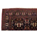 A VERY GOOD LARGE PERSIAN CARPET, with an all-over design on a blue ground. 11ft 6ins x 8ft 6ins.