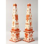 A LARGE PAIR OF OBELISKS with birds and motifs. 25ins high.