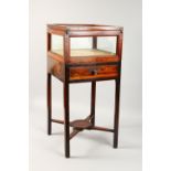 A SMALL 19TH CENTURY MAHOGANY BIJOUTERIE TABLE, with rising glass top, single drawer, on stretchered