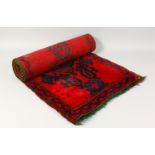 A TURKISH RUG with red and blue pattern. 5ft 7ins x 1ft 11ins.