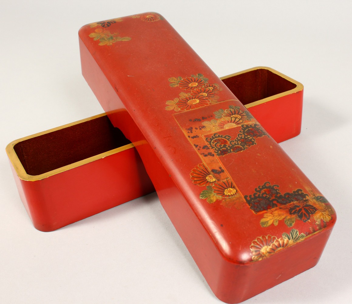 A JAPANESE LACQUER BOX. 10ins long.