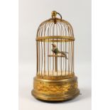 A GOOD SINGING BIRD MUSICAL BOX, in a cage. 11ins high.