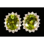 A PAIR OF 18CT YELLOW GOLD, IMPRESSIVE PERIDOT AND DIAMOND EARRINGS of 5.2cts.