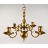 A SMALL DUTCH BRASS FOUR BRANCH CHANDELIER. 15ins wide x 11ins high.