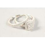 A 9CT GOLD DIAMOND ENGAGEMENT AND WEDDING RING (2).