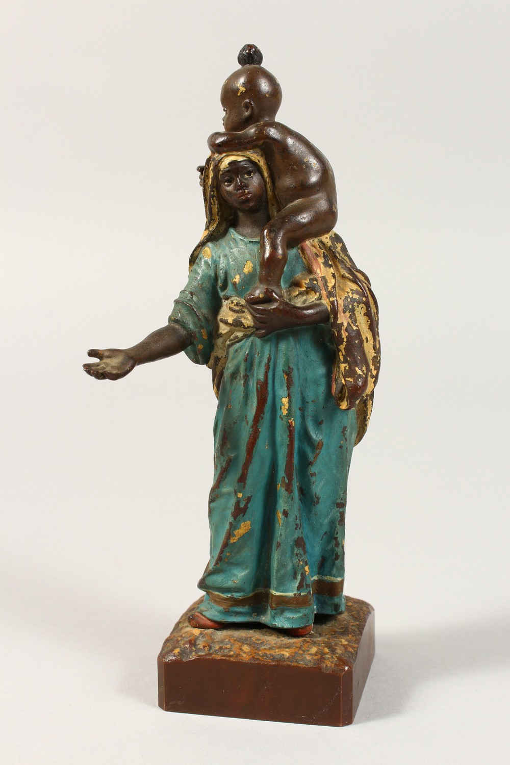 A VIENNA PAINTED COLD CAST BRONZE, ARAB GIRL CARRYING A BABY.