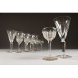 A SET OF SIX PLAIN GLASSES and SIX SHERRY GLASSES.