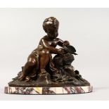 A GOOD BRONZE PUTTI with a dove, on a marble base. 10ins high.