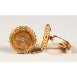 A PAIR OF 14CT GOLD AND DIAMOND CUFFLINKS.