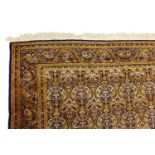 A PERSIAN GHOM CARPET, with an all-over paisley type pattern. 10ft x 6ft 10ins.