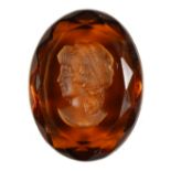 A CARVED AMBER OVAL CAMEO.